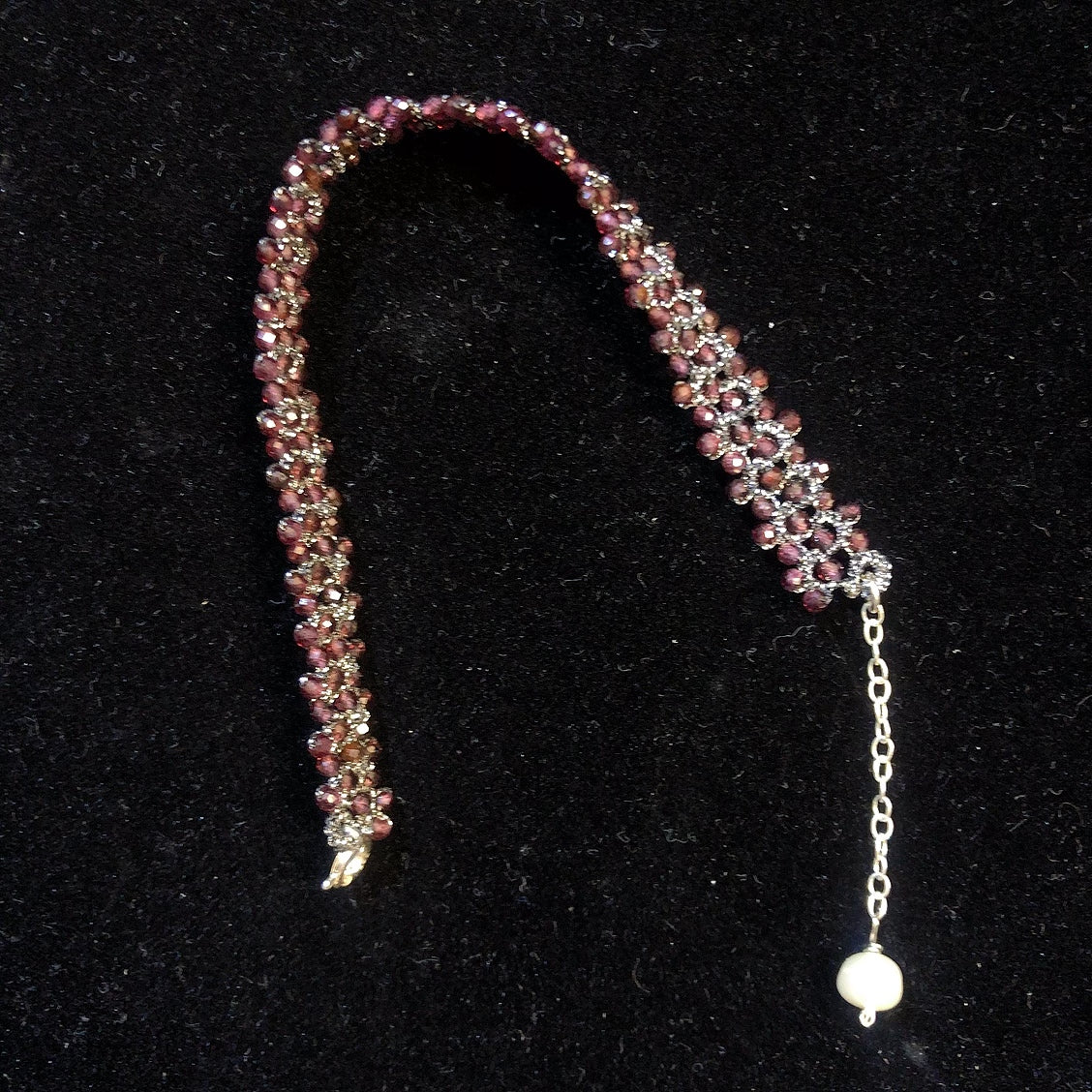 Handmade tatting bracelet with garnet beads